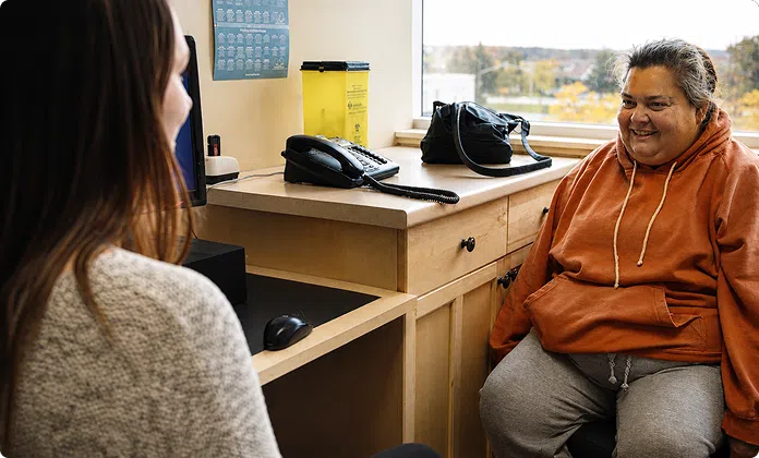 A patient meets with a member of the BCFHT care team